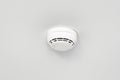 Smoke detector or fire alarm sensor on the ceiling. Royalty Free Stock Photo