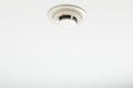 Smoke detector of fire alarm, white background Royalty Free Stock Photo
