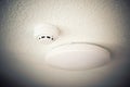 Smoke detector and fire protection system on ceiling Royalty Free Stock Photo