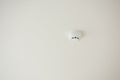 Smoke detector and fire protection system on ceiling. Royalty Free Stock Photo