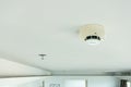 smoke detector and fire sprinkler on ceiling, fire alarming system and security system at home property for safety domestic life.