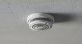 Smoke Detector on White Ceiling Closeup Royalty Free Stock Photo