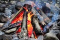 Smoke drifting out of a tepee campfire