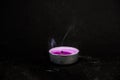 Smoke from an extinguished candle on  black background Royalty Free Stock Photo