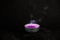 Smoke from an extinguished candle on  black background Royalty Free Stock Photo