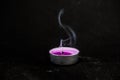 Smoke from an extinguished candle on  black background Royalty Free Stock Photo