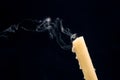 Smoke from an extinguished candle on a dark background. The concept of spirituality and the end of life Royalty Free Stock Photo