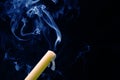 Smoke from an extinguished candle on a dark background. The concept of spirituality and the end of life Royalty Free Stock Photo