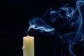 Smoke from an extinguished candle on a dark background. The concept of spirituality and the end of life Royalty Free Stock Photo