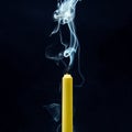 Smoke from an extinguished candle on a dark background. The concept of spirituality and the end of life Royalty Free Stock Photo