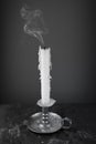 Smoke from an extinguished wax candle Royalty Free Stock Photo