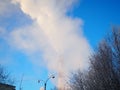 Smoke from a factory chimney. Ecological pollution. Air emissions polluting forest. Industrial waste. Industry Royalty Free Stock Photo