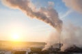 Smoke from factory chimneys on the background of sunrise Royalty Free Stock Photo