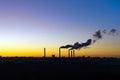 Smoke from the factory chimneys at sunset. concept of environmental pollution Royalty Free Stock Photo