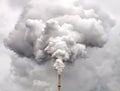 Smoke from factory pipe against overcast sky Royalty Free Stock Photo