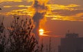 smoke factory sunrise big sun Royalty Free Stock Photo