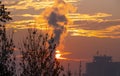 Smoke factory sunrise big sun Royalty Free Stock Photo