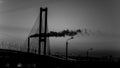 Smoke factory suspension bridges after sunset