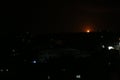 Smoke and flames rise after Israeli army war planes carried out airstrikes over of Deir Al-Balah in the central Gaza Strip Royalty Free Stock Photo