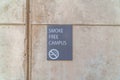 Smoke Free Campus sign on exterior wall of school building in San Diego CA