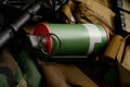 Smoke grenade with military equipment Royalty Free Stock Photo