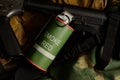 Smoke grenade with military equipment Royalty Free Stock Photo