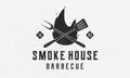 Smoke House - vintage logo concept. Logo of Barbecue, Grill, Smoke house with fire flame, grill fork and spatula. BBQ logo, poster Royalty Free Stock Photo