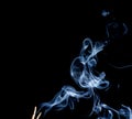 Smoke of joss stickon black background Royalty Free Stock Photo