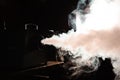 Smoke machine in action, lights in smoke, studio lights shining through the smoke from smoke machine Royalty Free Stock Photo