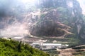 Smoke mixing with dust particle in open limestone mining at Masigit mountain