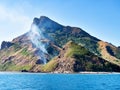 Smoke on a mountain on a tropical island Royalty Free Stock Photo
