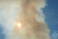 Smoke obscured sun. Smog and Sunny sky. Emissions of pollution into atmosphere. Smoke from fire. Hazardous industry. Toxic waste