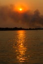 Smoke over the Okavango River