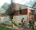 Smoke pours out a door of a house on fire in Adelphi, Maryland Royalty Free Stock Photo