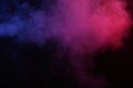 Artificial magic smoke in red-blue light on black background Royalty Free Stock Photo