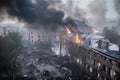 Smoke rise from burning bombed destroyed building