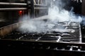 smoke rising while grates getting scrubbed