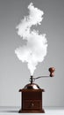 Smoke Shaped Like Dollar Sign Rising From Coffee Grinder Royalty Free Stock Photo