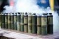 smoke signal canisters arranged in a row