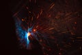 Smoke and sparks on a black background. The great explosion and the formation of a new universe. An abstract image of outer space. Royalty Free Stock Photo