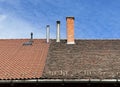 Smoke stacks on the roof of a building Royalty Free Stock Photo