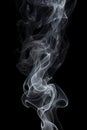 Smoke is steaming up against a black background, in the style of tenebrism Royalty Free Stock Photo