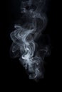 Smoke is steaming up against a black background, in the style of tenebrism Royalty Free Stock Photo