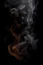 Smoke is steaming up against a black background, in the style of tenebrism Royalty Free Stock Photo