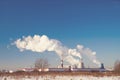 Smoke tower of CHP and blue sky. Central Electric Heat. Winter Royalty Free Stock Photo