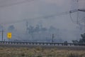 Smoke from wildfire causing very low visibilty near power lines and a freeway in Nevada