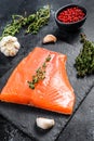 Smoked Atlantic salmon fillet. Organic fish. Black background. Top view Royalty Free Stock Photo