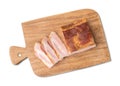 Smoked bacon with slices isolated over white background Royalty Free Stock Photo