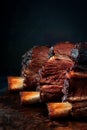 Smoked beef brisket on the ribs with a dark crust on a wooden Board. Classic Texas barbecue Royalty Free Stock Photo