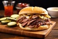 smoked beef brisket sandwich with pickles and bbq sauce Royalty Free Stock Photo